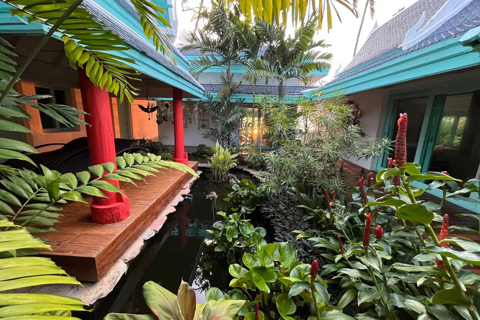 Tropical inner garden with fish pond at the villa on Koh Samui